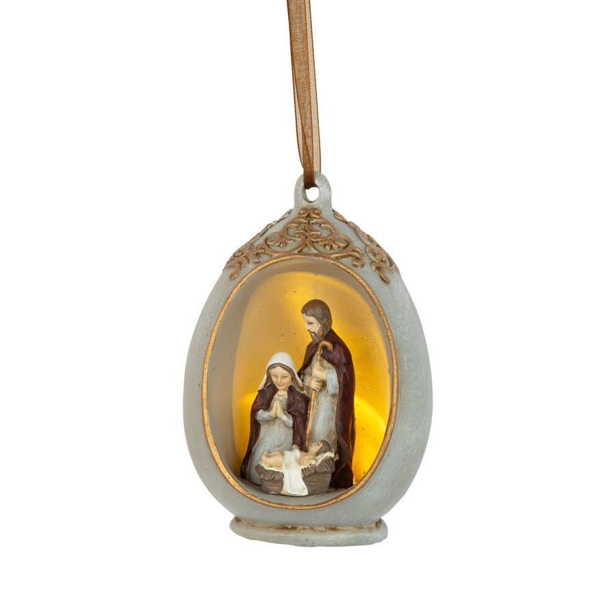 A49308:Painted resin nativity scene in egg shaped frame,L